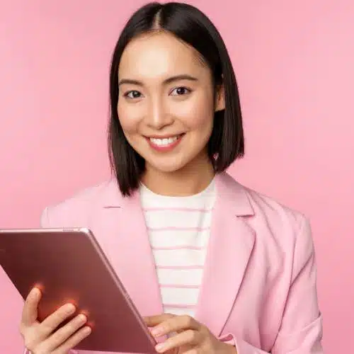 Image of business women dressed in pink clothes scheduling office plant consultation in NYC
